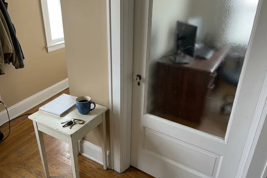 Glass-insert interior door with a frosted privacy panel into a home office