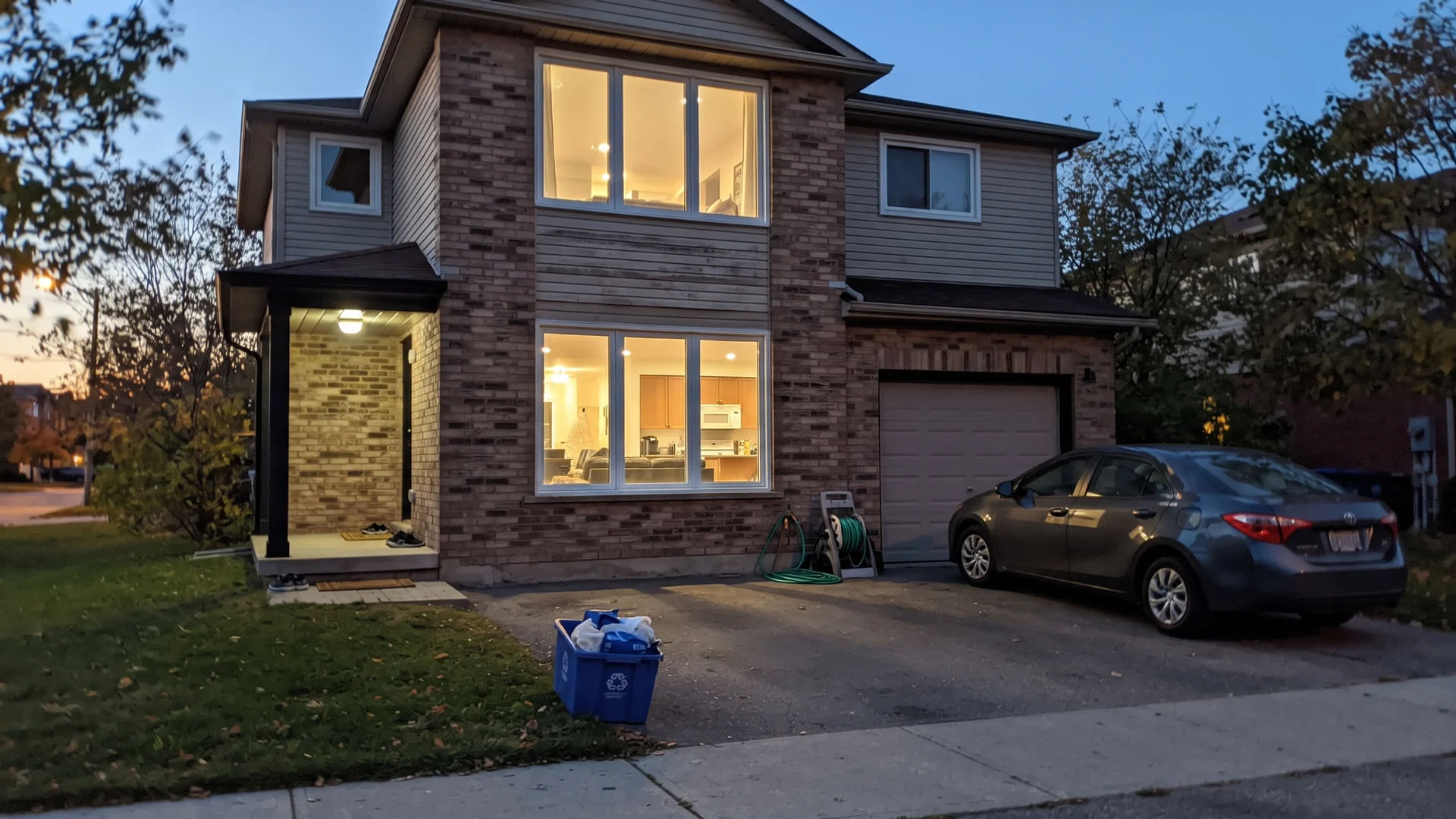 Greater Toronto Area home at dusk with large newly installed triple-pane windows