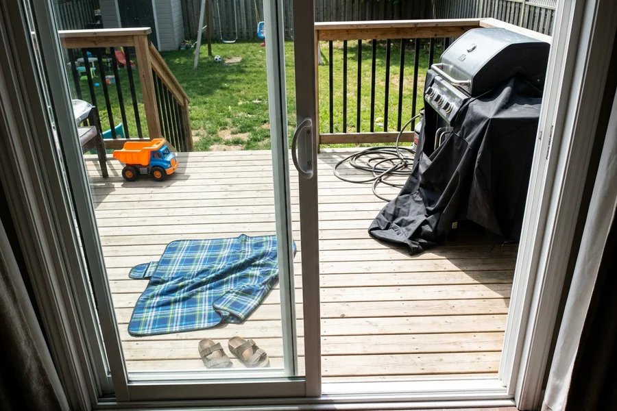 Wide sliding patio door onto the backyard deck of a Mississauga home